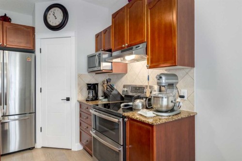 163 Cougarstone Court Sw, Calgary, AB - Indoor Photo Showing Kitchen With Stainless Steel Kitchen