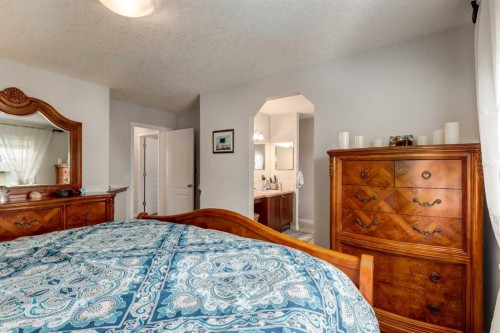 163 Cougarstone Court Sw, Calgary, AB - Indoor Photo Showing Bedroom