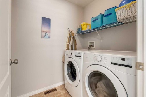 163 Cougarstone Court Sw, Calgary, AB - Indoor Photo Showing Laundry Room