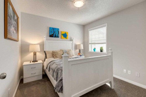 163 Cougarstone Court Sw, Calgary, AB - Indoor Photo Showing Bedroom