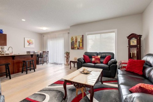 163 Cougarstone Court Sw, Calgary, AB - Indoor Photo Showing Living Room