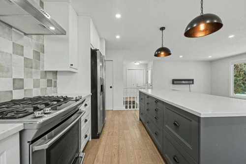 46 Benchlands Drive, Cochrane, AB - Indoor Photo Showing Kitchen With Upgraded Kitchen