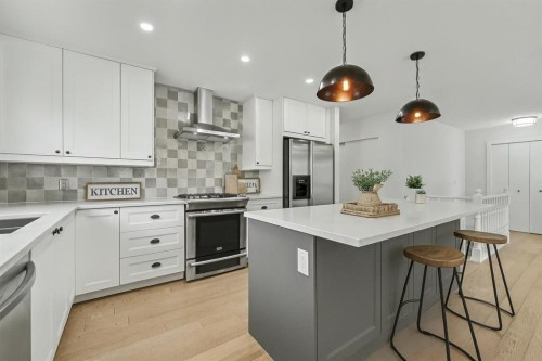 46 Benchlands Drive, Cochrane, AB - Indoor Photo Showing Kitchen With Upgraded Kitchen