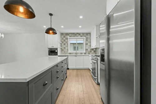 46 Benchlands Drive, Cochrane, AB - Indoor Photo Showing Kitchen With Upgraded Kitchen