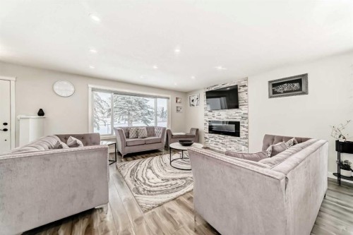 87 Rundleson Way Ne, Calgary, AB - Indoor Photo Showing Living Room With Fireplace