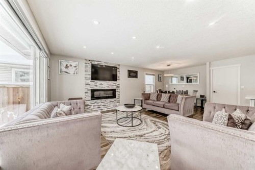 87 Rundleson Way Ne, Calgary, AB - Indoor Photo Showing Living Room With Fireplace