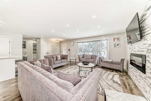 87 Rundleson Way Ne, Calgary, AB - Indoor Photo Showing Living Room With Fireplace