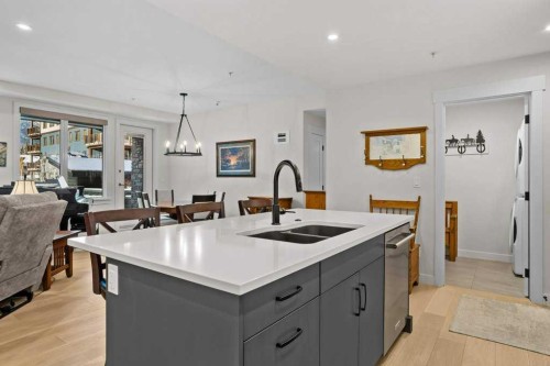 107-1315 Spring Creek Gate, Canmore, AB - Indoor Photo Showing Kitchen With Double Sink