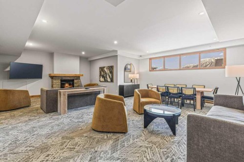 107-1315 Spring Creek Gate, Canmore, AB - Indoor Photo Showing Living Room With Fireplace