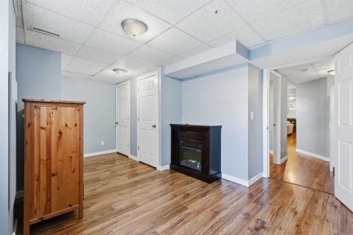 2 Woodfern Road Sw, Calgary, AB - Indoor With Fireplace