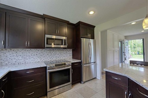 51 Hollyburn Road Sw, Calgary, AB - Indoor Photo Showing Kitchen With Upgraded Kitchen