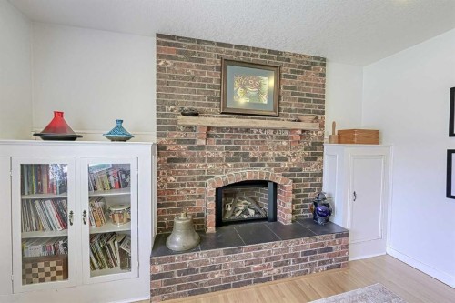 51 Hollyburn Road Sw, Calgary, AB - Indoor Photo Showing Living Room With Fireplace