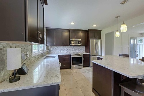 51 Hollyburn Road Sw, Calgary, AB - Indoor Photo Showing Kitchen With Double Sink With Upgraded Kitchen