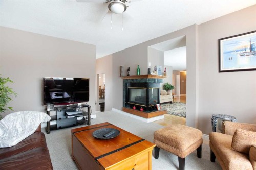 2607 Kelwood Drive Sw, Calgary, AB - Indoor Photo Showing Living Room With Fireplace