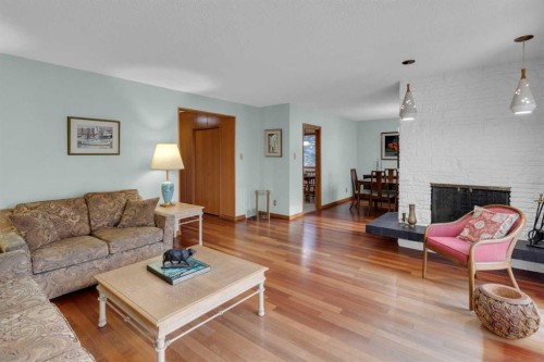 1801 Cayuga Drive Nw, Calgary, AB - Indoor Photo Showing Living Room With Fireplace