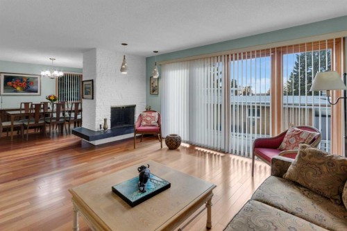 1801 Cayuga Drive Nw, Calgary, AB - Indoor Photo Showing Living Room With Fireplace