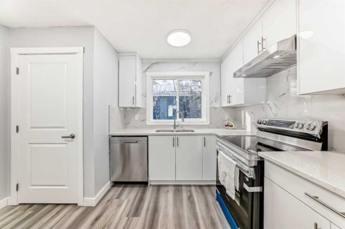 3429 33A Avenue Se, Calgary, AB - Indoor Photo Showing Kitchen With Stainless Steel Kitchen With Double Sink