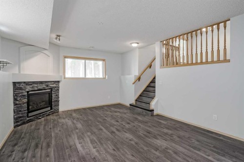 31 Panatella Drive Nw, Calgary, AB - Indoor With Fireplace