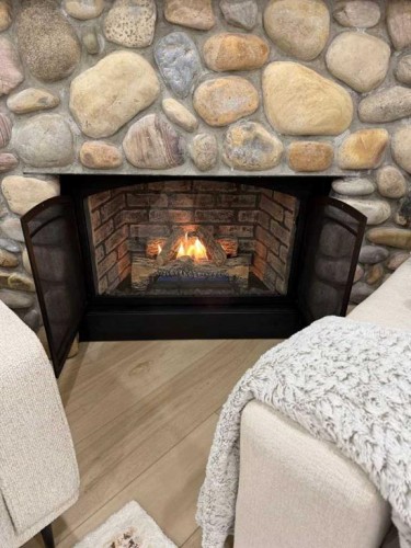 447 Tuscany Ridge Heights Nw, Calgary, AB - Indoor Photo Showing Living Room With Fireplace