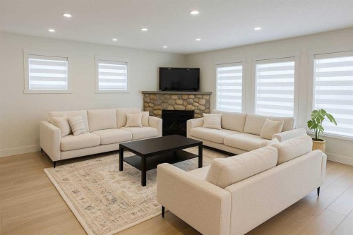 447 Tuscany Ridge Heights Nw, Calgary, AB - Indoor Photo Showing Living Room With Fireplace