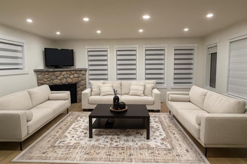 447 Tuscany Ridge Heights Nw, Calgary, AB - Indoor Photo Showing Living Room With Fireplace