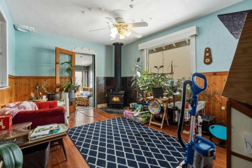 4115 580 Highway, Cremona, AB - Indoor With Fireplace