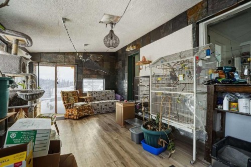 4115 580 Highway, Cremona, AB - Indoor With Fireplace