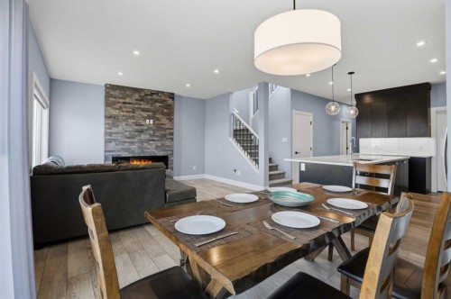 246 Walcrest View Se, Calgary, AB - Indoor Photo Showing Dining Room With Fireplace