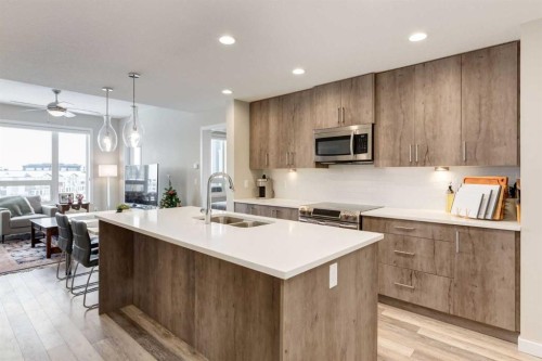 412-8531 8A Avenue Sw, Calgary, AB - Indoor Photo Showing Kitchen With Double Sink With Upgraded Kitchen