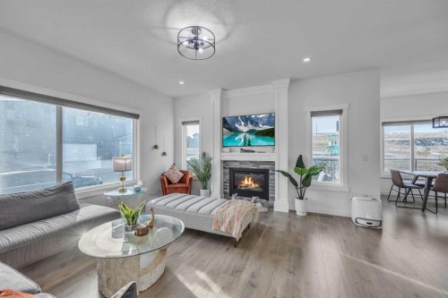 97 Baysprings Gardens Sw, Airdrie, AB - Indoor Photo Showing Living Room With Fireplace