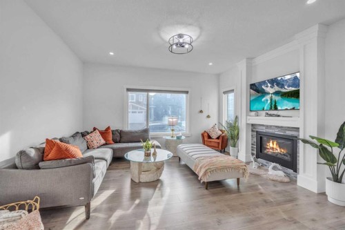 97 Baysprings Gardens Sw, Airdrie, AB - Indoor Photo Showing Living Room With Fireplace
