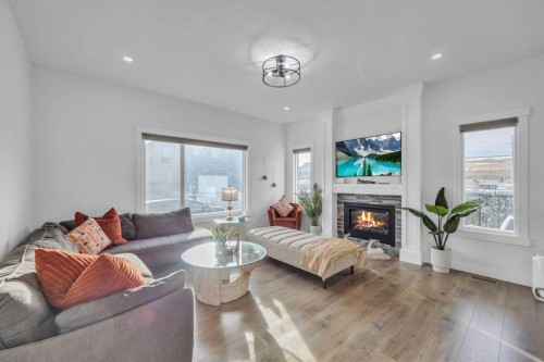 97 Baysprings Gardens Sw, Airdrie, AB - Indoor Photo Showing Living Room With Fireplace