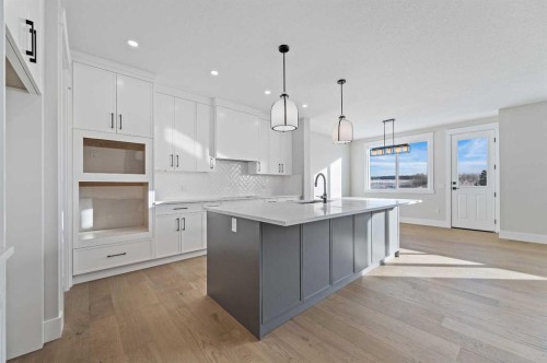 68 Heritage Ridge, Cochrane, AB - Indoor Photo Showing Kitchen With Upgraded Kitchen