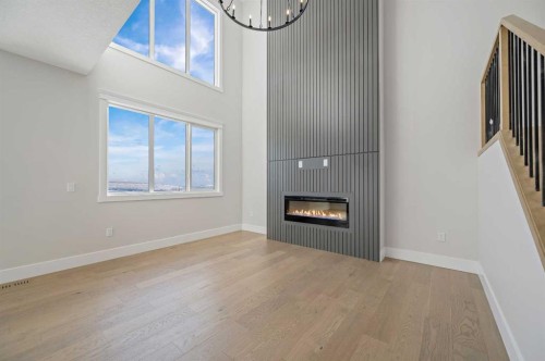 68 Heritage Ridge, Cochrane, AB - Indoor Photo Showing Other Room With Fireplace