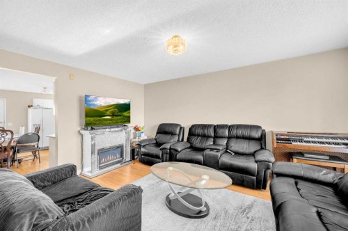 120 Castlebrook Rise Ne, Calgary, AB - Indoor Photo Showing Living Room With Fireplace