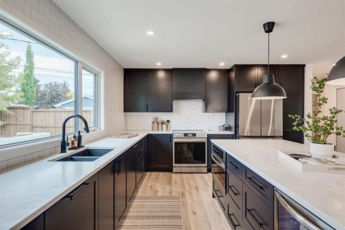1240 Mapleglade Crescent Se, Calgary, AB - Indoor Photo Showing Kitchen With Double Sink With Upgraded Kitchen