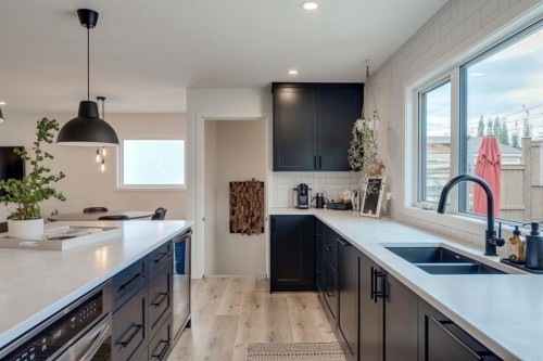 1240 Mapleglade Crescent Se, Calgary, AB - Indoor Photo Showing Kitchen With Double Sink
