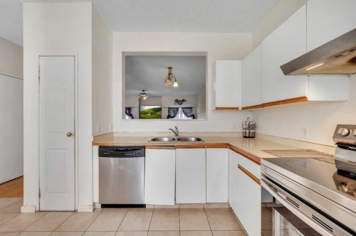 137 Martinpark Way Ne, Calgary, AB - Indoor Photo Showing Kitchen With Double Sink