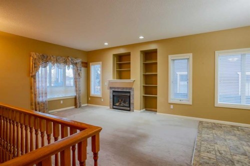 1105 Hammond Avenue, Crossfield, AB - Indoor Photo Showing Other Room With Fireplace