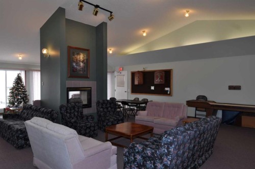 16 Edenwold Green Nw, Calgary, AB - Indoor Photo Showing Living Room With Fireplace
