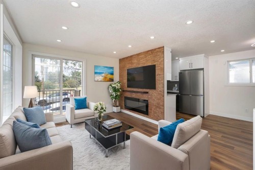 140 Whitworth Way Ne, Calgary, AB - Indoor Photo Showing Living Room With Fireplace