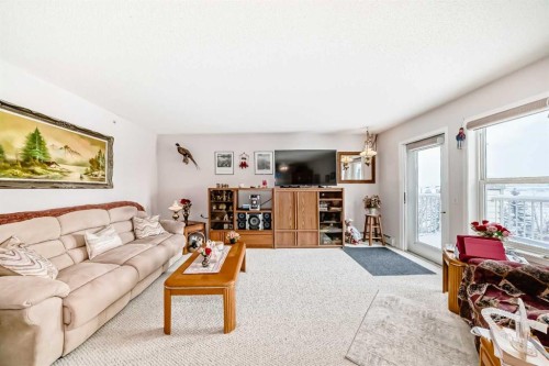 410-5000 Somervale Court Sw, Calgary, AB - Indoor Photo Showing Living Room