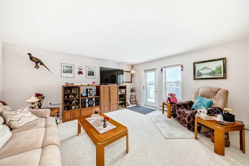 410-5000 Somervale Court Sw, Calgary, AB - Indoor Photo Showing Living Room