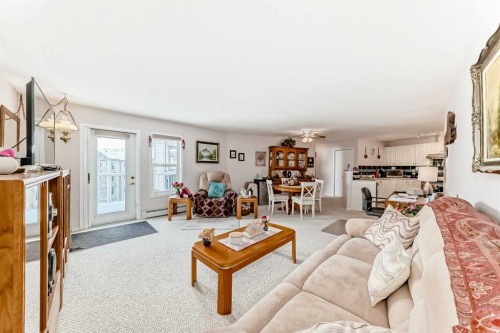 410-5000 Somervale Court Sw, Calgary, AB - Indoor Photo Showing Living Room
