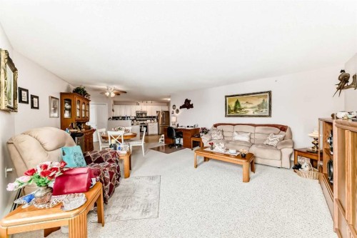 410-5000 Somervale Court Sw, Calgary, AB - Indoor Photo Showing Living Room