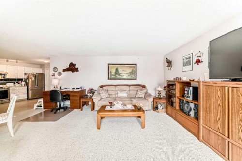 410-5000 Somervale Court Sw, Calgary, AB - Indoor Photo Showing Living Room