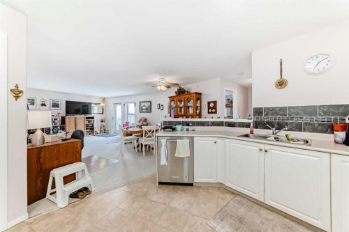 410-5000 Somervale Court Sw, Calgary, AB - Indoor Photo Showing Kitchen With Double Sink