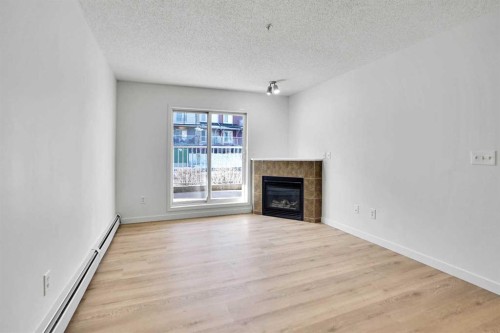 4109-70 Panamount Drive Nw, Calgary, AB - Indoor Photo Showing Living Room With Fireplace
