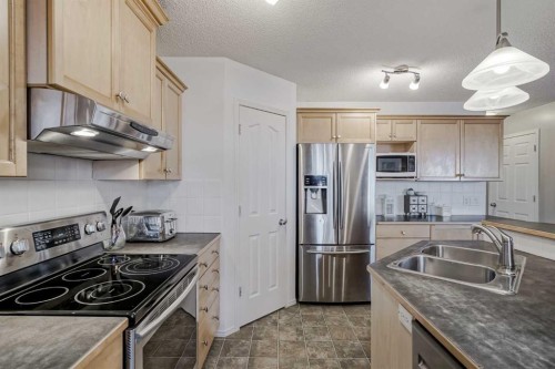 212 Cove Court, Chestermere, AB - Indoor Photo Showing Kitchen With Double Sink