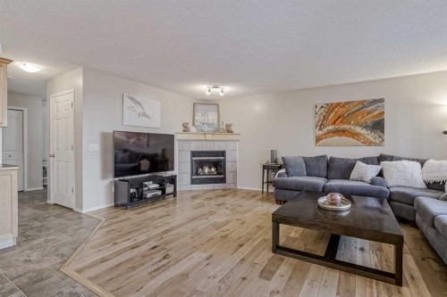 212 Cove Court, Chestermere, AB - Indoor Photo Showing Living Room With Fireplace